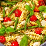 Chicken pasta with asparagus and tomatoes in a delicious sauce