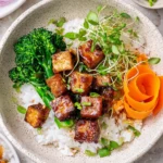 Crispy marinated tofu served with vegetables on a plate