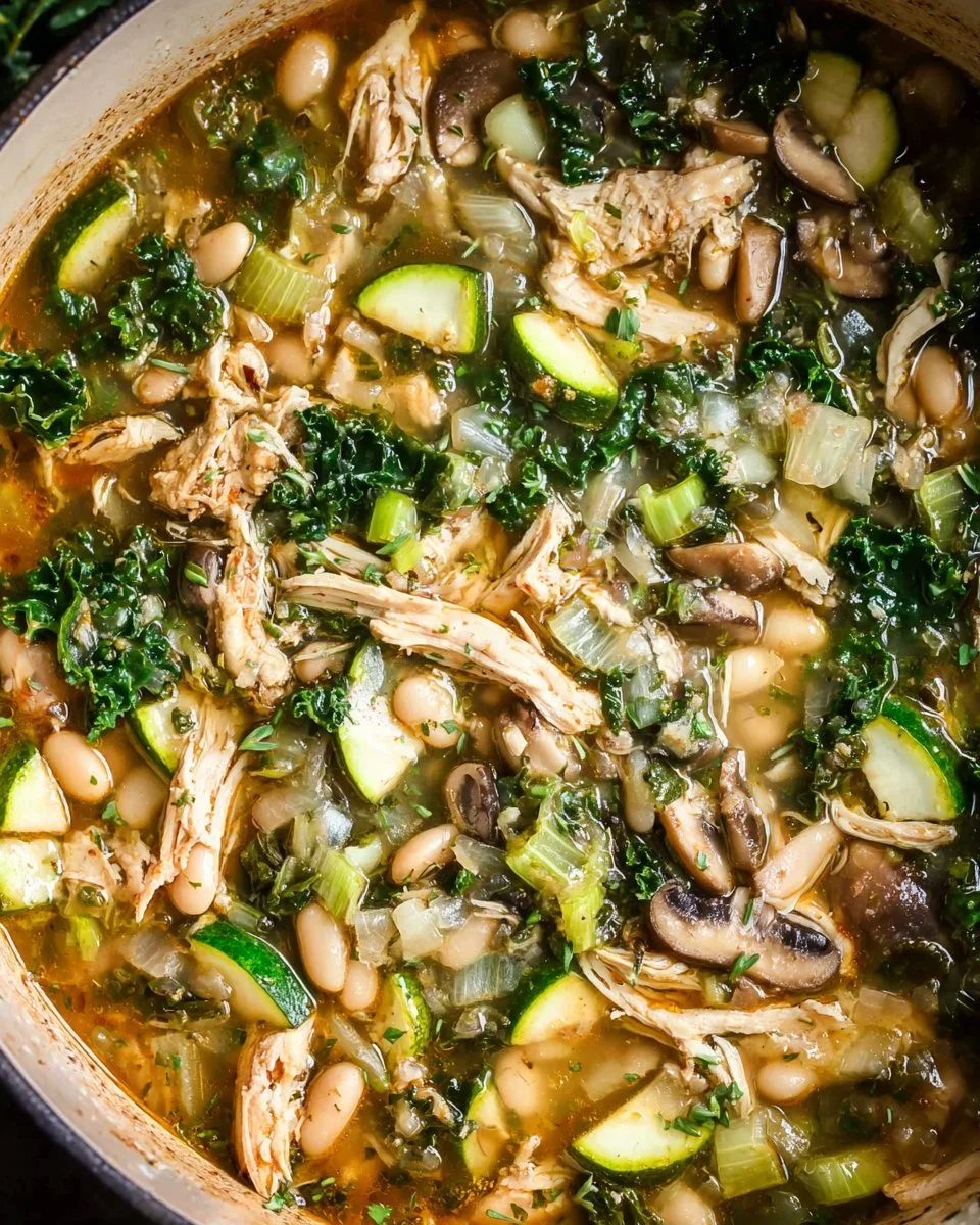 Bowl of easy 30-minute kale soup with white beans and chicken.