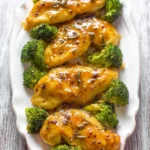 Easy honey mustard chicken dish served with vegetables on a plate.