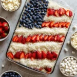 Delicious Flag Cake decorated with strawberries and blueberries for a festive celebration.