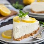 Delicious Frozen Lemon Pie served with lemon slices and whipped cream.