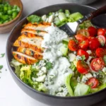 Grilled Buffalo Chicken Salad with Greek Yogurt Blue Cheese Dressing served in a bowl
