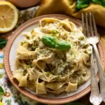 Bowl of creamy Lemon Mascarpone Pasta garnished with lemon zest and herbs