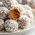 No Bake Carrot Cake Energy Bites with nuts and spices on a plate