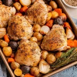 Delicious roasted chicken thighs cooked on a sheet pan with vegetables