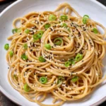 Delicious sesame noodles served with vegetables and sesame sauce