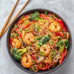 A plate of flavorful Shrimp Lo Mein noodles with vegetables and shrimp