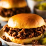 Delicious Sloppy Joes served with fresh toppings on a bun