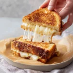 Delicious apple butter grilled cheese sandwich with melted cheese and bread