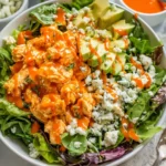 Buffalo Chicken Salad with spicy chicken, fresh greens, and dressing