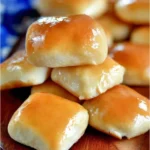 Freshly baked Copycat Texas Roadhouse Rolls served with butter