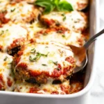 Delicious Eggplant Parmesan dish layered with cheese and marinara sauce.