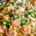 Delicious Jalapeno Shrimp Nachos topped with fresh ingredients