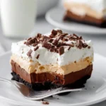 Delicious no bake peanut butter pie topped with whipped cream and chocolate drizzle
