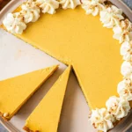 No bake pumpkin cheesecake topped with whipped cream and spices