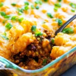 One Pot Mexican Tater Tot Casserole topped with crispy tater tots and cheese