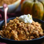 Delicious homemade Pumpkin Crisp dessert topped with a crunchy streusel.