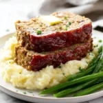 Delicious Stuffing Meatloaf served on a plate with garnishes