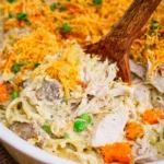 Creamy Turkey Tetrazzini dish served with pasta and vegetables.