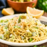 Delicious Dirty Martini Pasta garnished with olives and herbs
