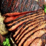 Juicy grilled beef steak served with fresh herbs and sides
