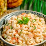 Delicious bowl of Hawaiian Macaroni Salad with creamy dressing and colorful veggies
