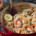 One Pot Lemon Orzo with Shrimp served in a bowl, garnished with parsley.