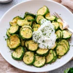 Plate of crispy roasted ranch zucchini bites seasoned to perfection