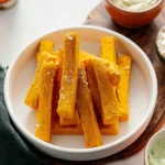 Delicious homemade chickpea fries served with dipping sauce