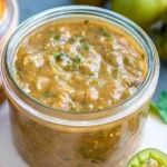 Roasted Green Tomato Salsa Verde served in a bowl with tortilla chips
