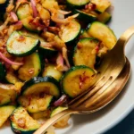 Plate of sautéed zucchini seasoned with herbs and spices